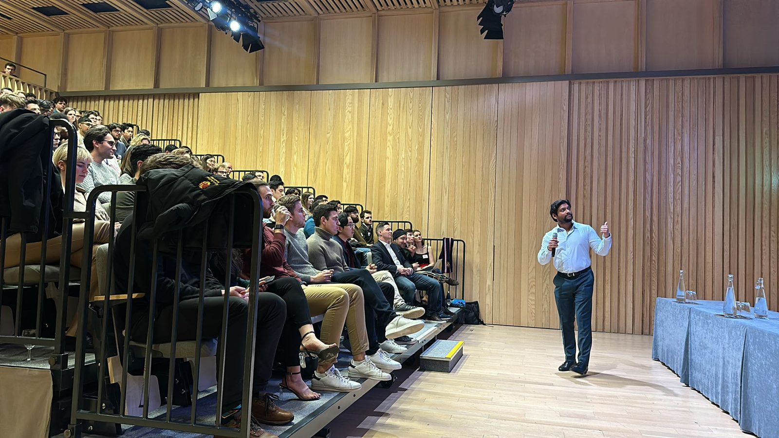 Amu Chandra speaking to an audience